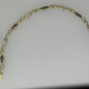 BRACCIALE IN ORO GIALLO GR. 8,80 di PESO e RUBINI ZAFFIRI, SMERALDI E BRILLANTI. Lunghezza cm 18,50